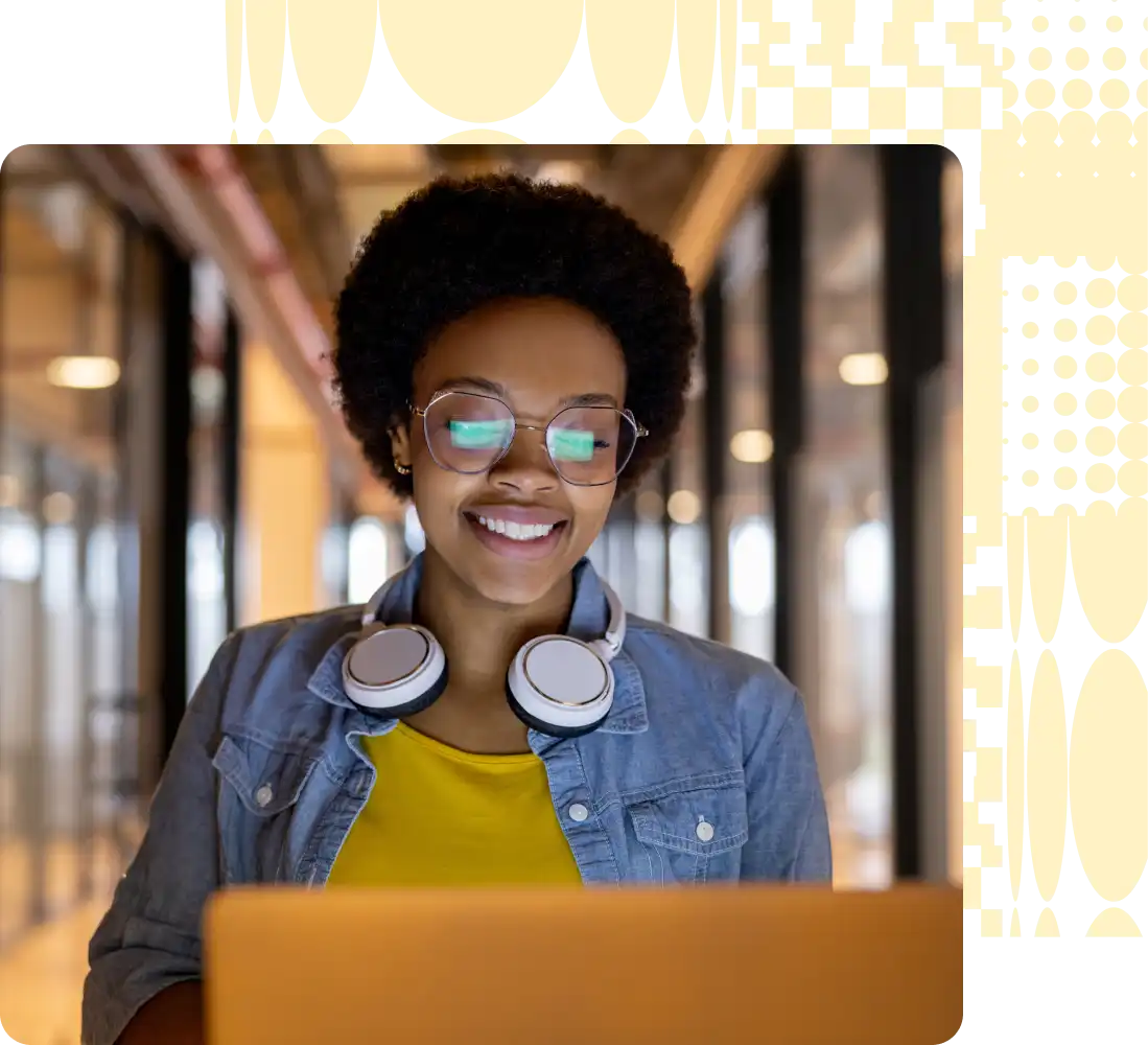 Group of people smiling at laptop